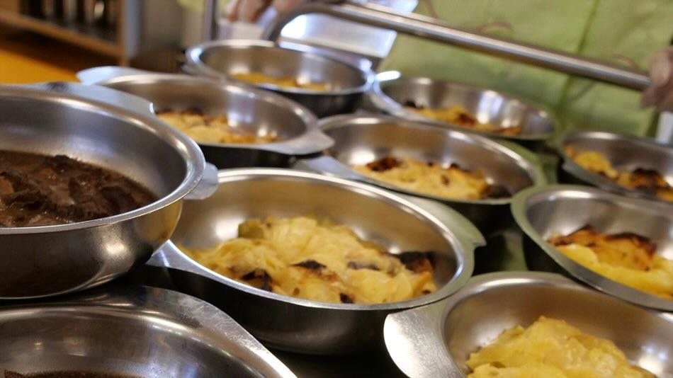French school cafeteria trolley with beef and potatoes