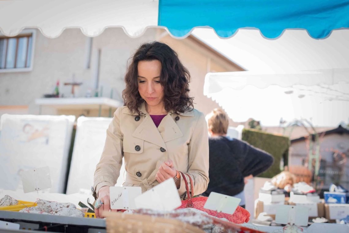 French woman shopping for food at a local market