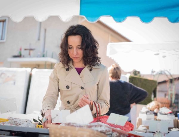 French woman shopping for food at a local market