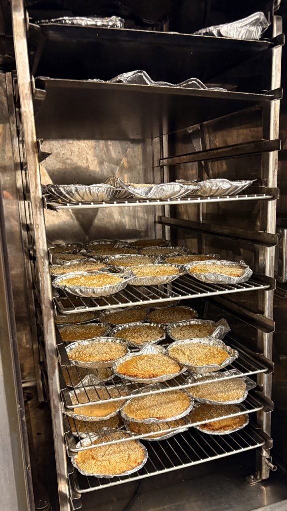 Christmas lunch at French elementary school. Scallop puree heating in industrial oven.